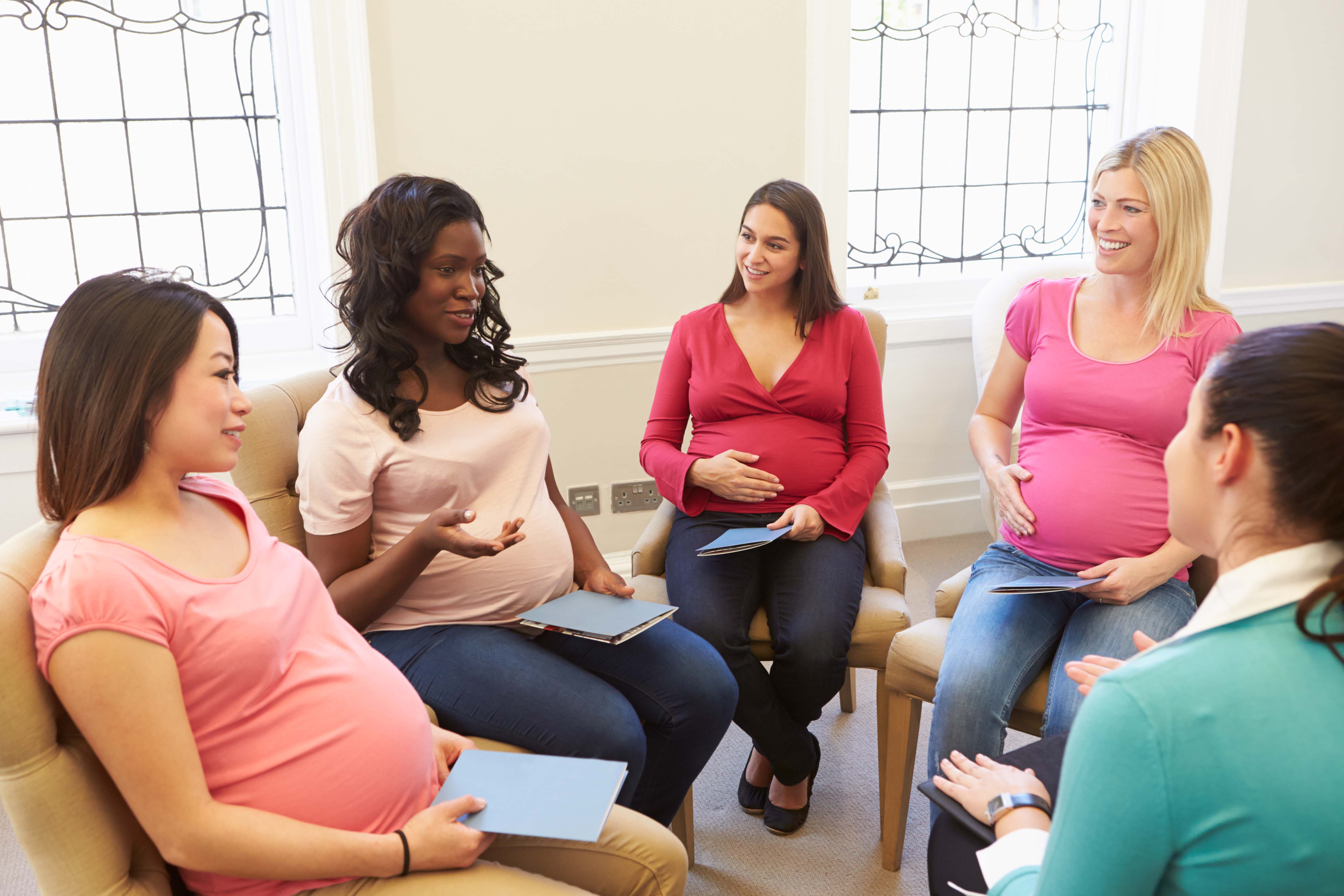 Pregnant people talking with Social Worker.