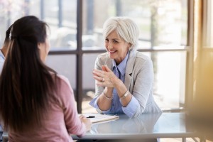 Social Worker Talking With Female Client